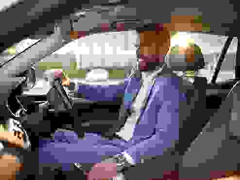 A corporate guy sitting in his car